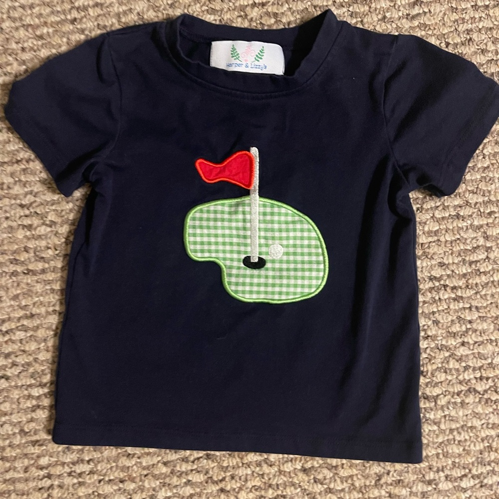 Navy Kids Golf Shirt with Red and Green Design